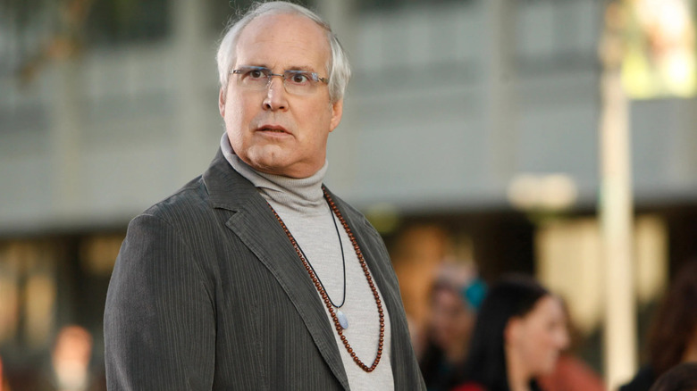 Chevy Chase as Pierce Hawthorne looks back with a surprised look in Community.
