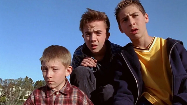 Frankie Muniz as Malcolm looks confused alongside his brothers in Malcolm in the Middle.
