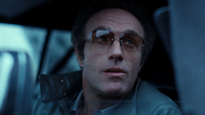 James Caan as Frank wears sunglasses and looks out of a car window in Thief.