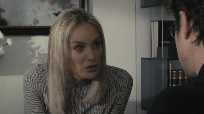 Sharon Stone as Ludovica Stern talks to Riccardo Scamarcio as Davide Bias' in an office in A Golden Boy.