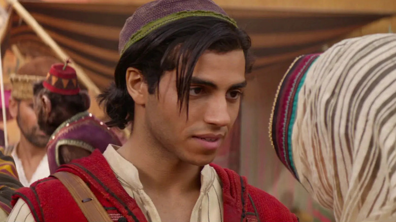 Mena Massoud as Aladdin encounters the undercover Princess Jasmine