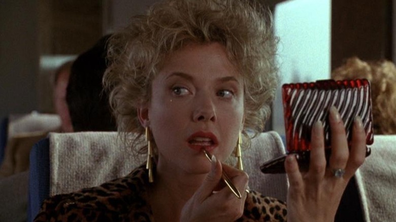 Annette Bening as Myra Langtry, doing her makeup in The Grifters.