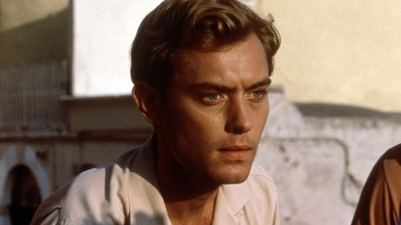 Jude Law as Dickie Greenleaf, looking downward in The Talented Mr. Ripley.