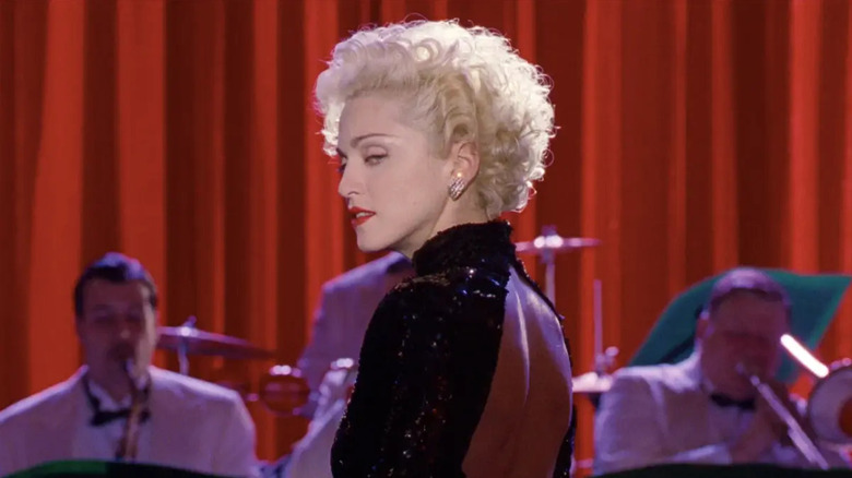 Madonna as Breathless Mahoney, looking over her shoulder in a performance from Dick Tracy.