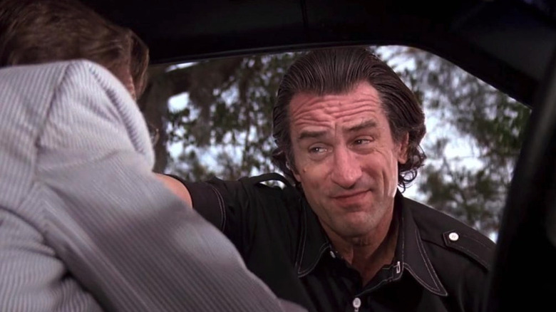 Robert De Niro as Max Caddy leers at Nick Nolte as Sam Bowden sitting in his car in Cape Fear