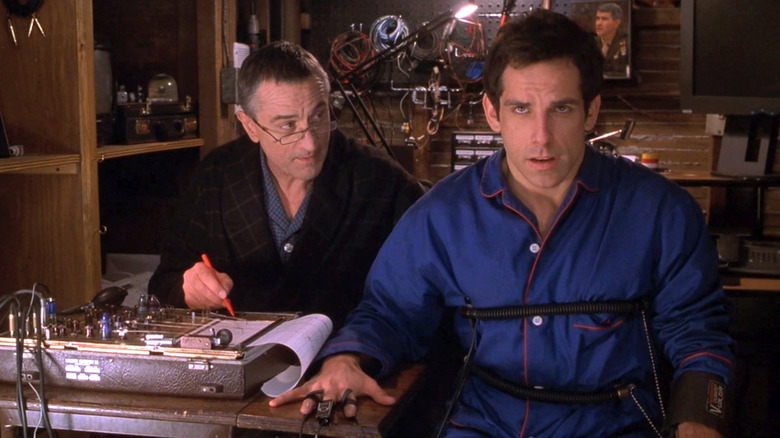 Robert De Niro as Jack Byrnes operating a lie detector that Ben Stiller as Greg Focker is hooked up to in Meet the Parents