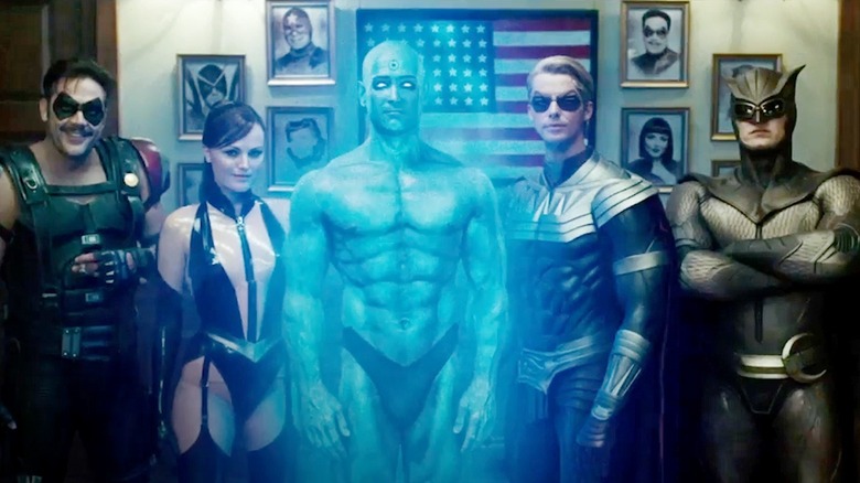 The Watchmen standing in front of the American flag