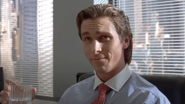 Patrick Bateman (Christian Bale) smirking in American Psycho