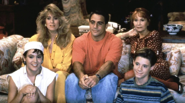Alyssa Milano as Samantha Micelli, Judith Light as Angela Bower, Tony Danza as Tony Micelli, Katherine Helmond as Mona Robinson, and Danny Pintauro as Jonathan Bower gather around the TV in the Bower family's living room in Who's The Boss?