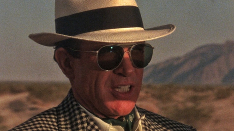 Bugsy Siegel (Warren Beatty) drives in a desert in Bugsy