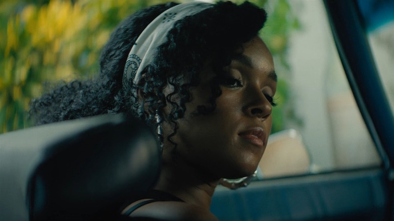 Teresa (Janelle Monae) looking to the right in her car in Moonlight