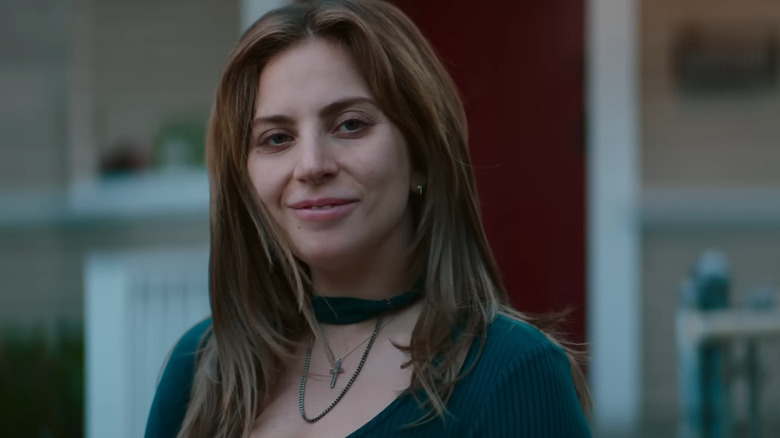 Ally (Lady Gaga) smiling at Jackson (Bradley Cooper) in A Star is Born