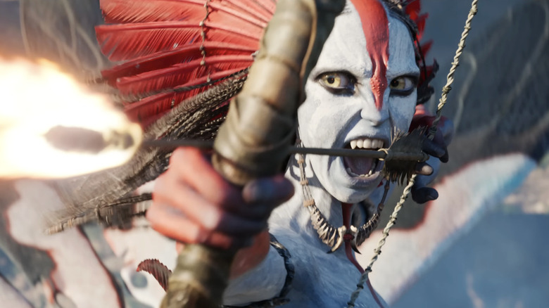 Varang (Oona Chaplin) snarls while firing a flaming arrow in Avatar: Fire & Ash