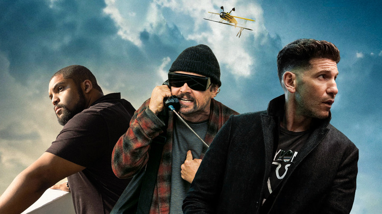 Donnie from Den of Thieves: Pantera, Bob from One Battle After Another, and Braxton from The Accountant 2 (with Ethan Hunt hanging on a plane in the background)