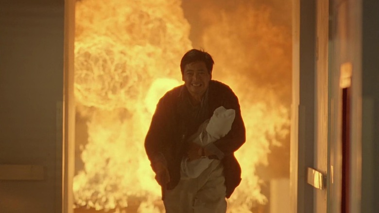Chow Yun-fat as Tequila, rescuing a baby from an inferno in Hard Boiled