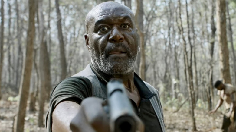 Delroy Lindo as Paul pointing a gun in Da 5 Bloods