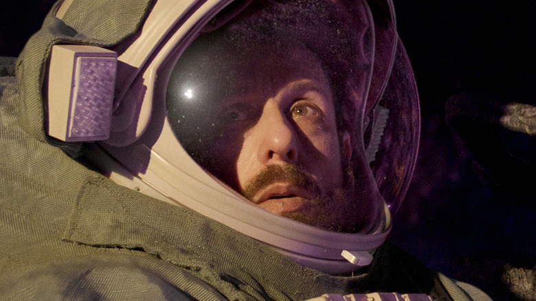 Adam Sandler as Jakub wearing a spacesuit in Spaceman