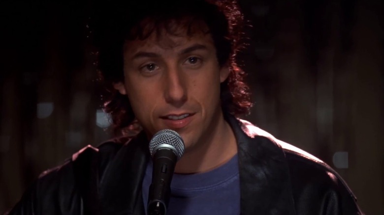 Adam Sandler as Robbie performing on stage in The Wedding Singer