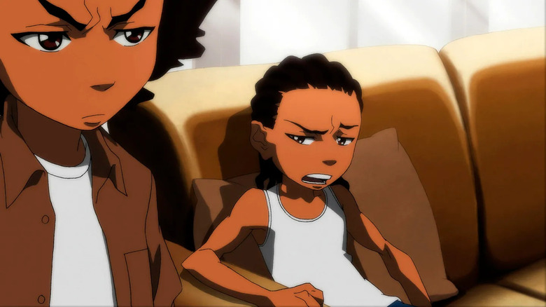 Riley Freeman (Regina Hall) speaks to Huey Freeman (King) from the couch in The Boondocks
