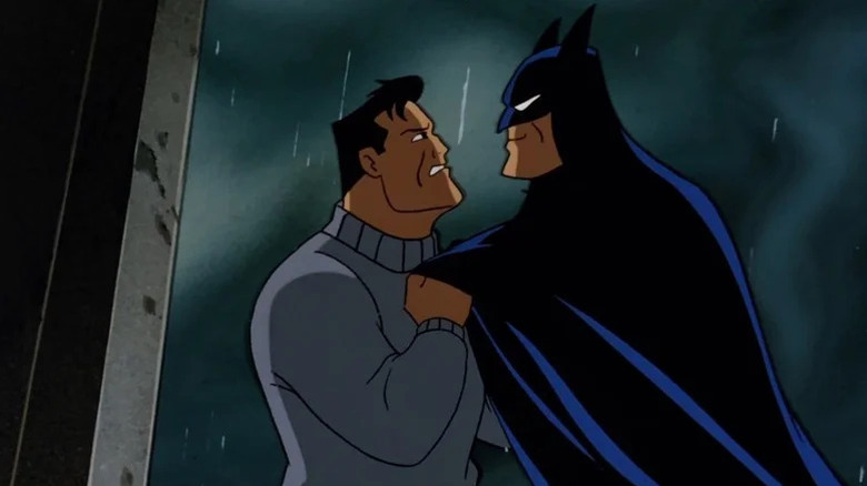 Bruce Wayne (Kevin Conroy) grabs a smirking Batman (Conroy) in Batman: The Animated Series
