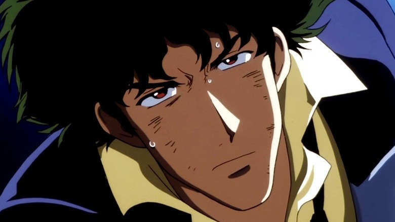 A bruised and sweaty Spike Spiegel glares in Cowboy Bebop