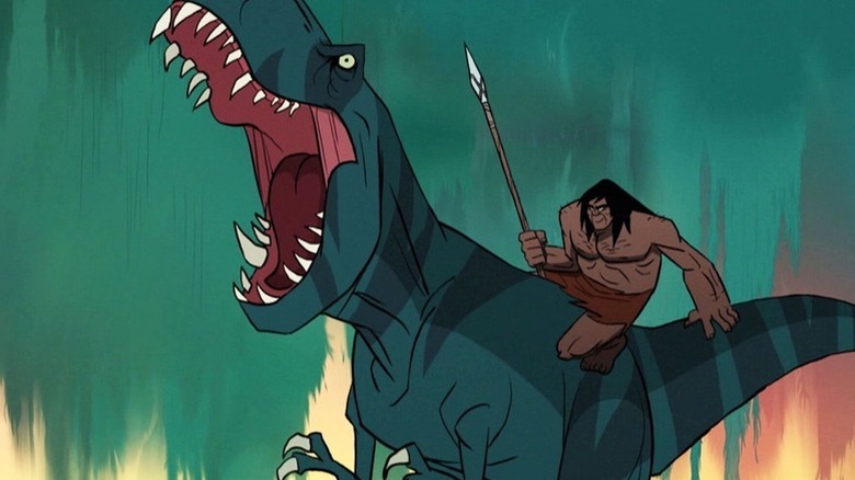 Fang (Joel Valentine) roars with a smiling Spear (Aaron LaPlante) on her back in Primal