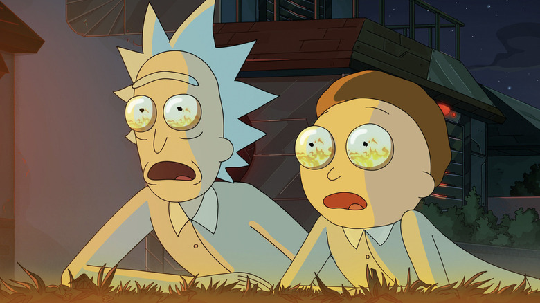 Rick Sanchez and Morty Smith look up horrified with fire in their eyes in Rick and Morty