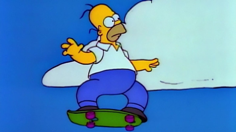 Homer Simpson (Dan Castellaneta) rides a skateboard in the air in The Simpsons