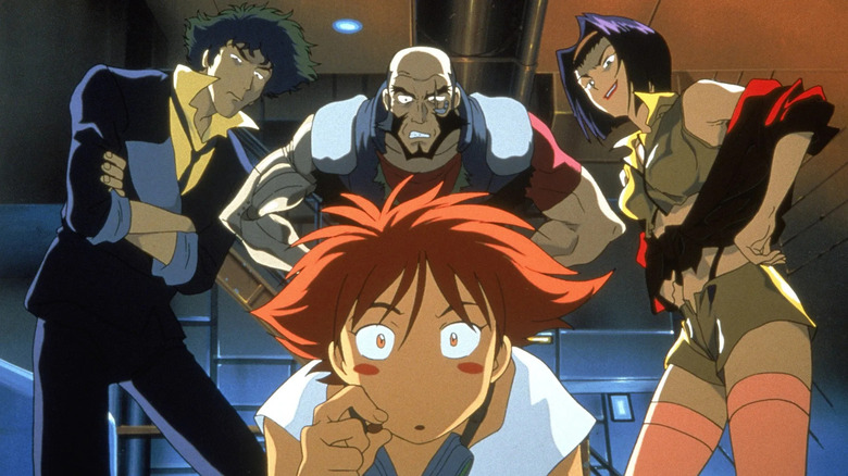 Edward crouches in front of an impatient Spike Spiegel, Jet Black, and Faye Valentine in Cowboy Bebop