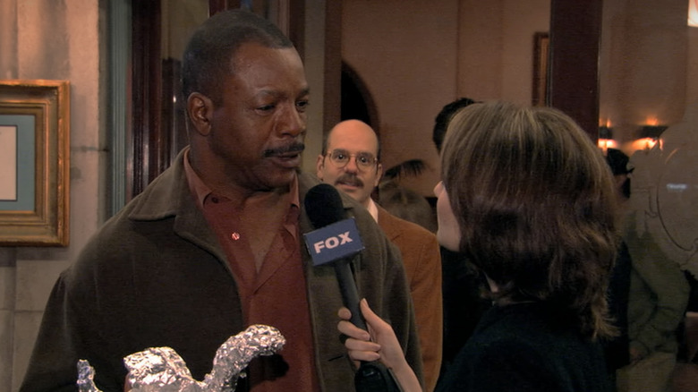 Carl Weathers as himself, giving an interview with Tobias in the background on Arrested Development