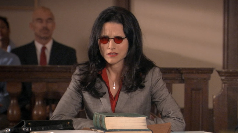 Julia Louis-Dreyfus as Maggie Lizer, sitting in court on Arrested Development