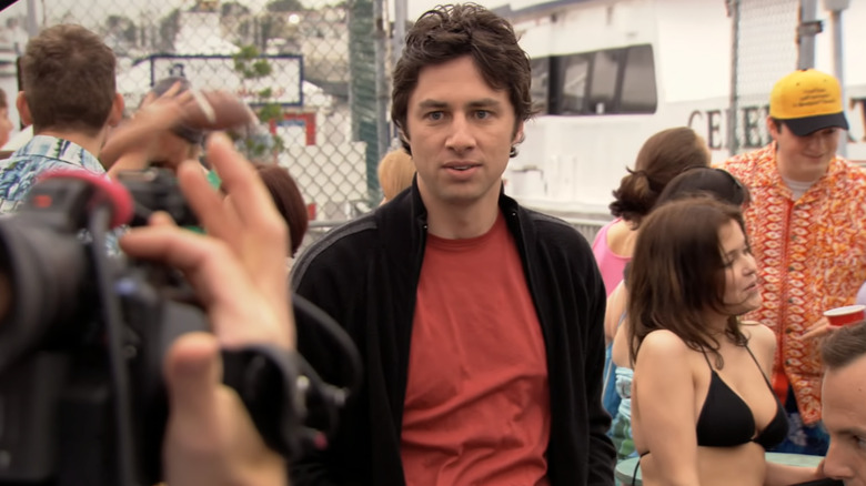 Zach Braff as Phillip Litt, filming a segment on Arrested Development