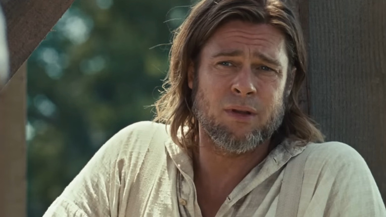 Brad Pitt as Samuel Bass looking concerned in 12 Years a Slave.