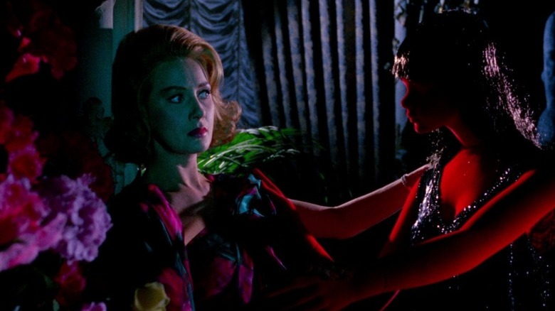 Arianna Gorini as Nicole touching a red mannequin in Blood and Black Lace