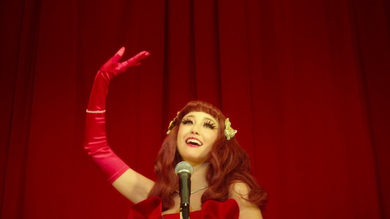 Erika Sawajiri as Lilico Hirukoma singing in front of a red curtain in Helter Skelter