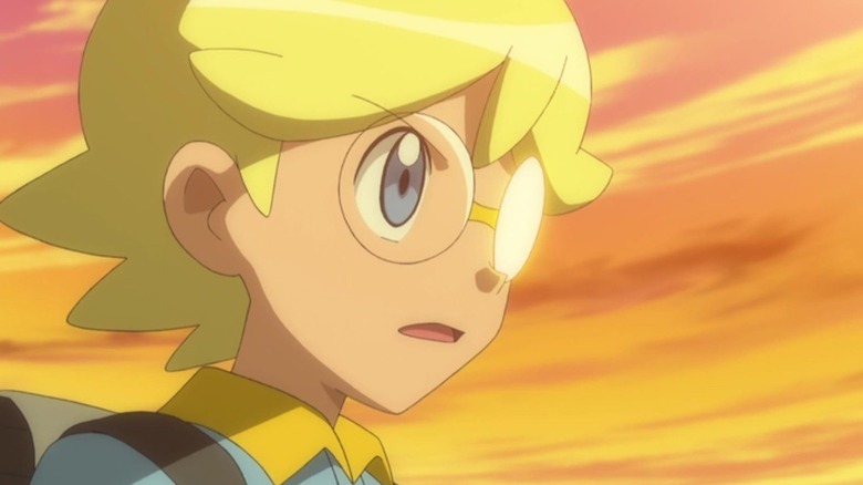 Clemont staring determined at a sunset in Pokemon the Series: XY
