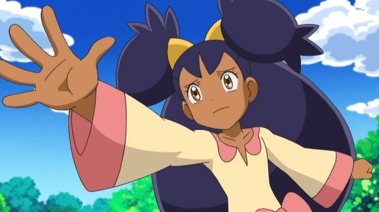 Iris reaching out her hand with glistening eyes in Pokemon the Series: Black & White