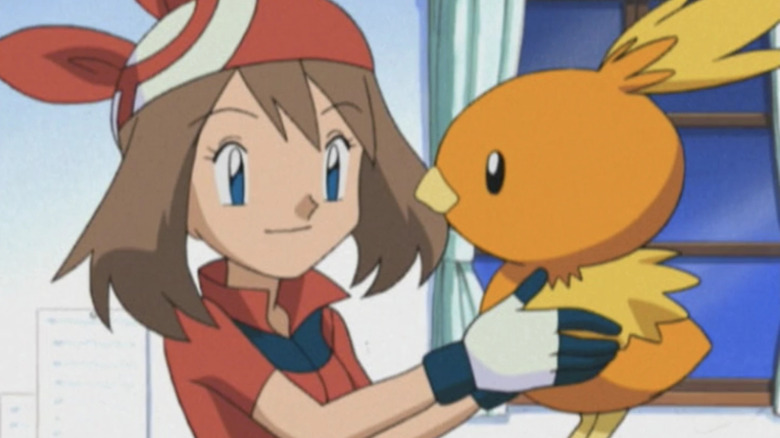 May holding up Torchic in Pokemon Advanced