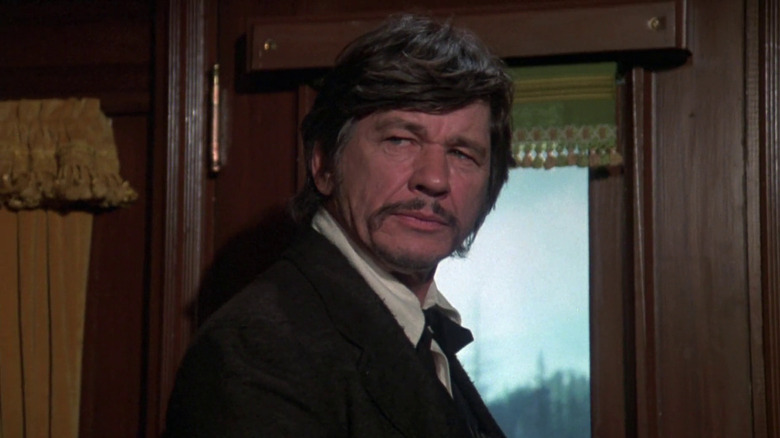 Charles Bronson as Deakin, suspecting everyone in Breakheart Pass