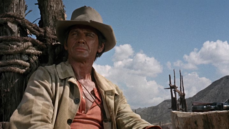 Charles Bronson as Harmonica, taking a break in Once Upon a Time in the West