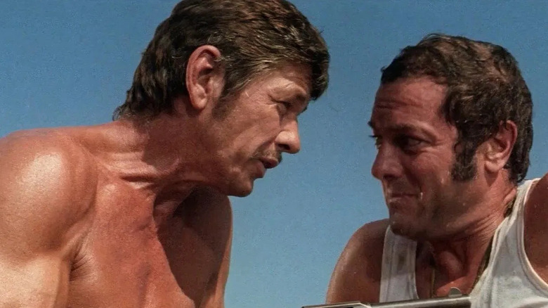 Charles Bronson as Josh and Tony Curtis as Adam, bantering in You Can't Win 'em All