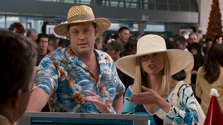Vince Vaughn and Reese Witherspoon as Brad and Katie, waiting at the airport in Four Christmases