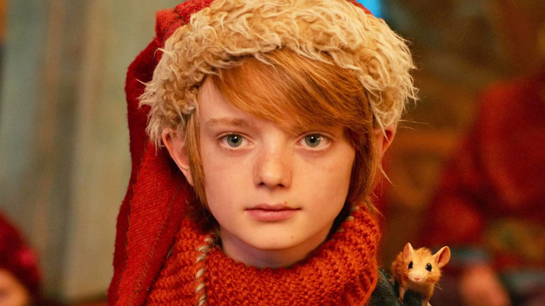 Henry Lawfull as Nikolas, standing with a mouse on his shoulder in A Boy Called Christmas