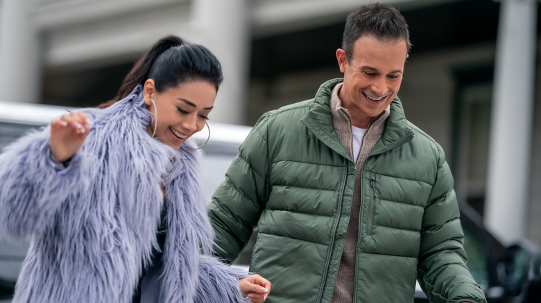 Aimee Garcia as Angelina and Freddie Prinze Jr. as Miguel, smiling together in Christmas with You