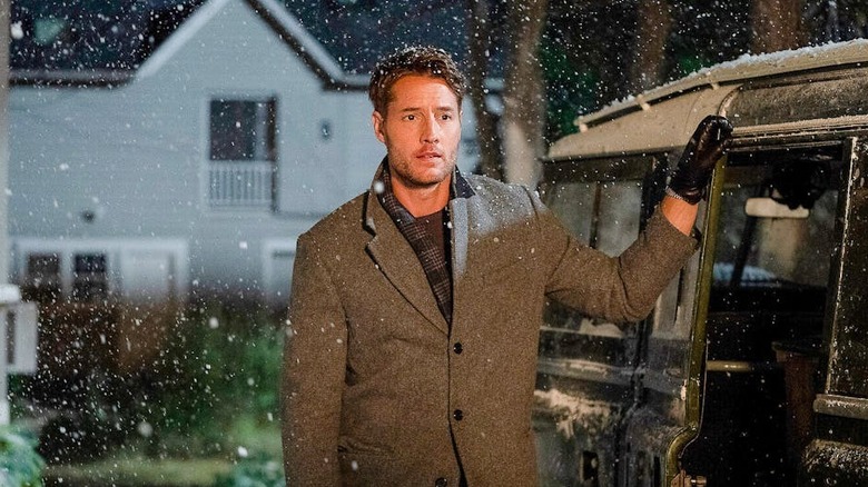 Justin Hartley as Jake Turner, standing in the snow in The Noel Diary