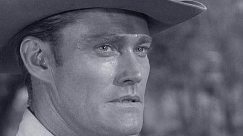 A stern Lucas McCain (Chuck Connors) stares ahead in The Rifleman