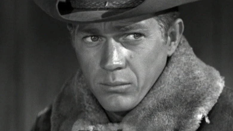 Josh Randall (Steve McQueen) looks warily while wearing a winter coat in Wanted Dead or Alive