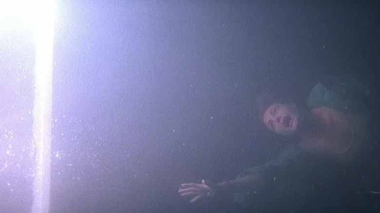 Lisa Blount as Catherine, getting pulled into the mirror dimension in Prince of Darkness