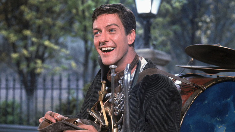 Dick Van Dyke as Bert with his instrument backpack in Mary Poppins