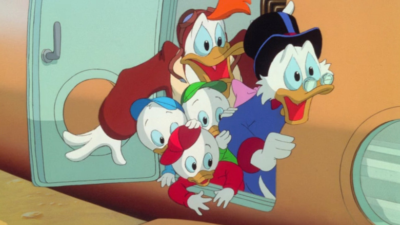Launchpad, Huey, Dewey, Louie, and Uncle Scrooge exit their plane after a crash landing in Ducktales The Movie: Treasure of the Lost Lamp